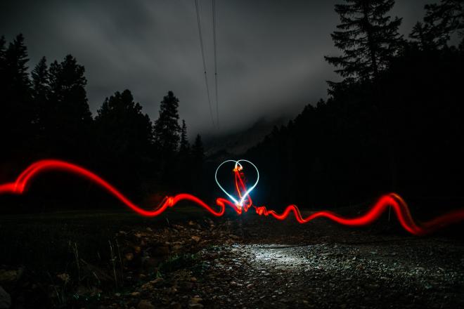 Light art drawing a heart and heart signal.